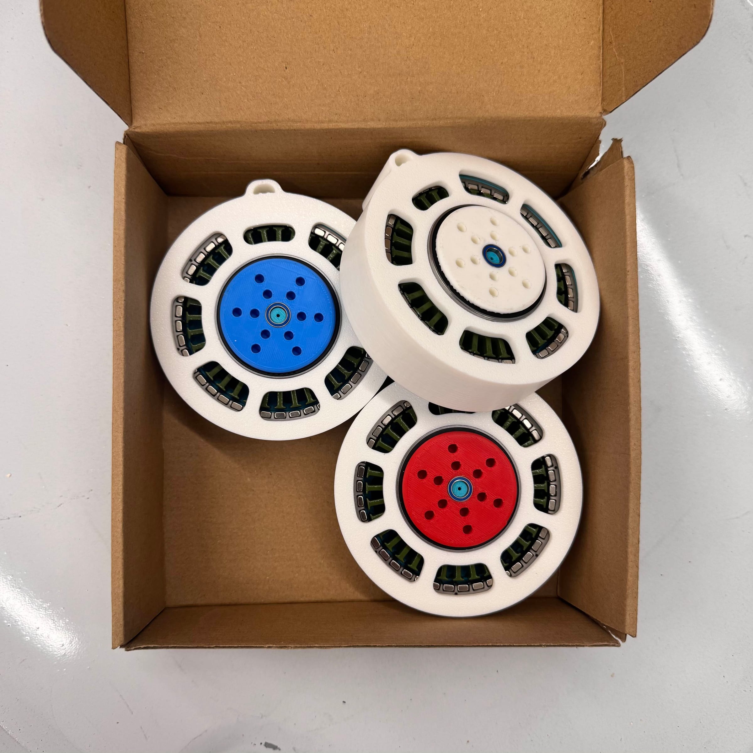 A box of hand-wound custom actuators.